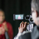 Videography and Photography at The Performing Arts Academy A young student films another young student during videography class